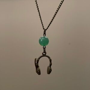 Portable radio headphone with green aventurine gemstone necklace